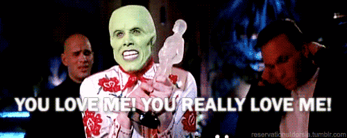 The Mask holding an award